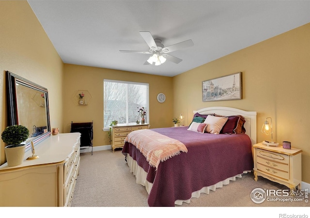 bedroom featuring light carpet and ceiling fan