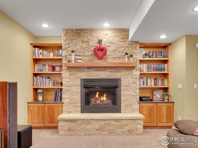 carpeted living room featuring a fireplace