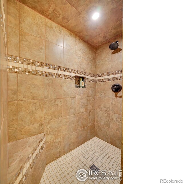 bathroom with tiled shower