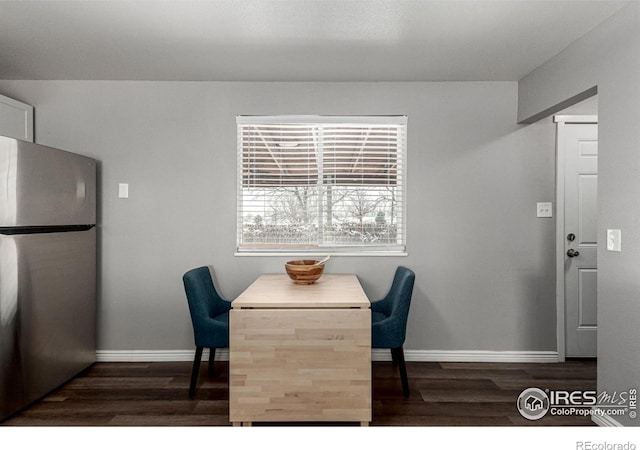 dining room with dark hardwood / wood-style flooring