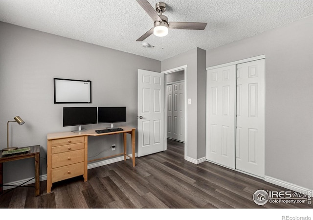 office space with ceiling fan, dark hardwood / wood-style flooring, and a textured ceiling