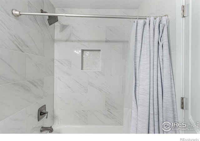 bathroom featuring shower / tub combo with curtain