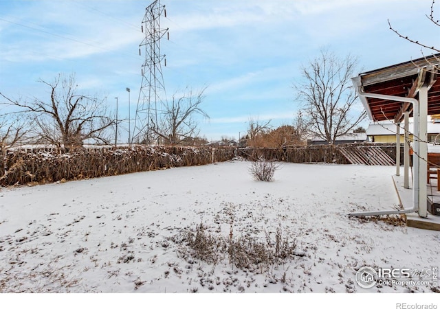 view of yard layered in snow