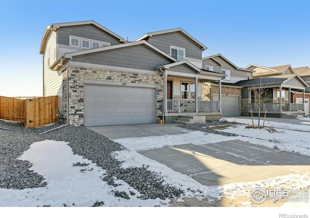 view of front of home with a porch and a garage