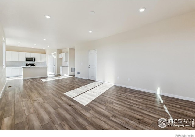 unfurnished living room with light hardwood / wood-style floors