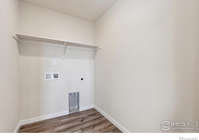 washroom with hookup for an electric dryer, dark hardwood / wood-style floors, and washer hookup