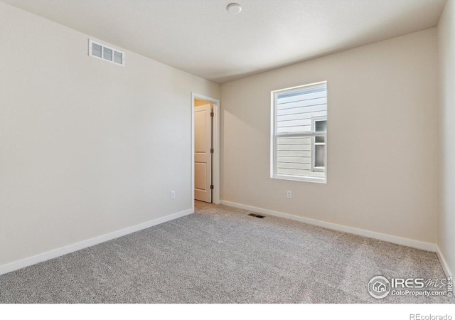 view of carpeted spare room