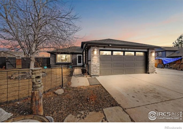 prairie-style house featuring a garage