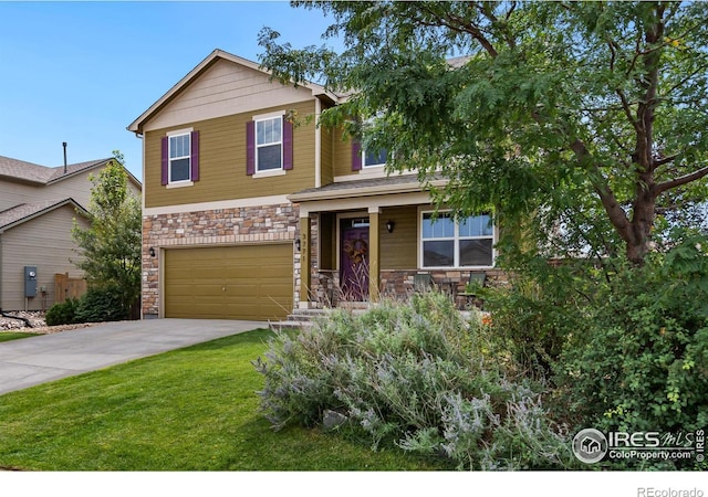 view of front of property featuring a garage and a front yard