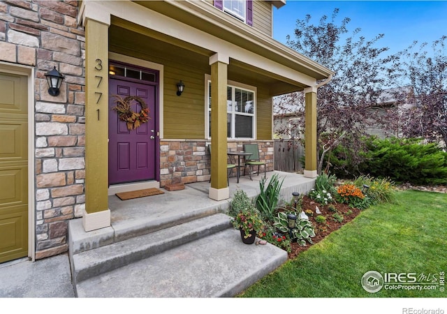 view of exterior entry featuring a porch