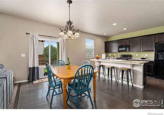 dining area with dark hardwood / wood-style flooring