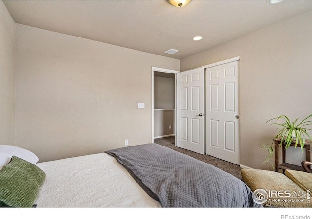 bedroom with a closet and carpet flooring