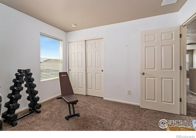 workout room featuring carpet