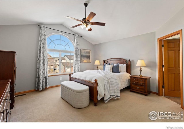 carpeted bedroom featuring vaulted ceiling and ceiling fan