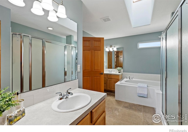 bathroom with shower with separate bathtub, vanity, and an inviting chandelier