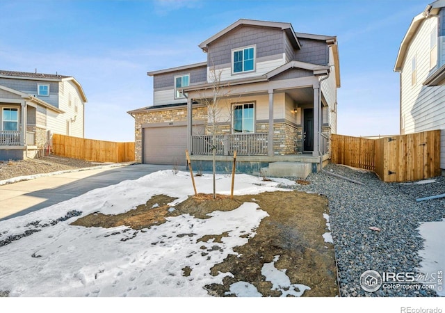 view of front of property with a garage and a porch