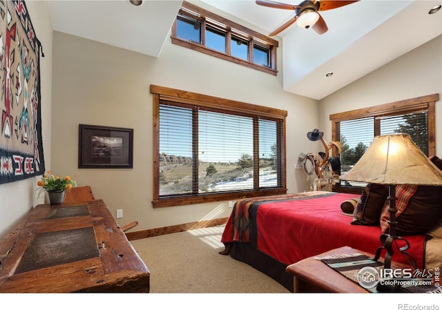 bedroom with carpet flooring, high vaulted ceiling, and multiple windows