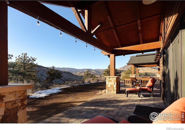 view of patio with a mountain view