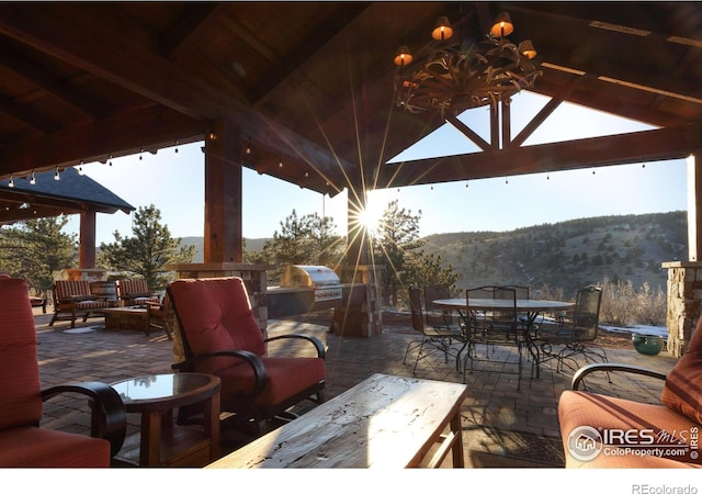 view of patio / terrace with area for grilling, a mountain view, a gazebo, and grilling area