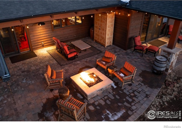 view of patio / terrace with an outdoor fire pit