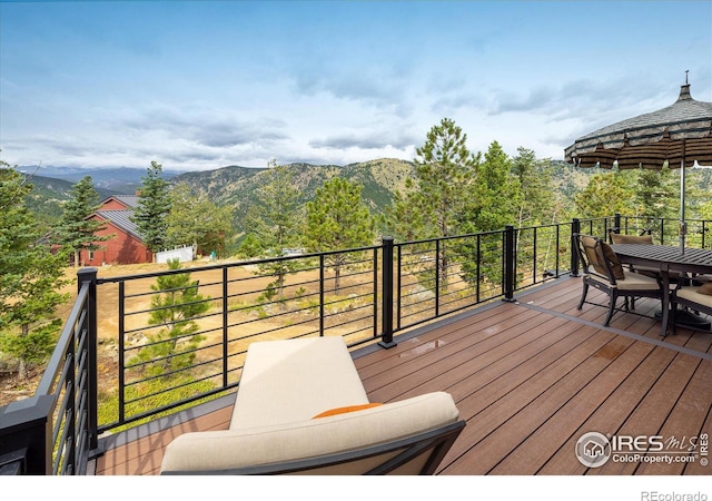 wooden deck with a mountain view