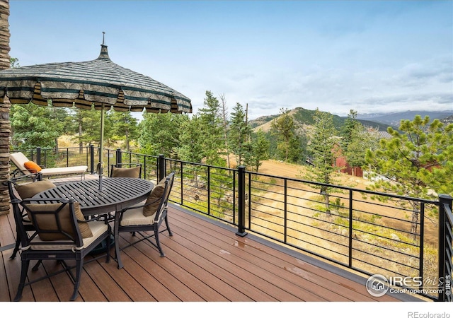 wooden deck featuring a gazebo and a mountain view