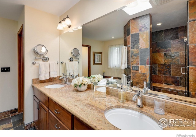 bathroom featuring vanity and an enclosed shower