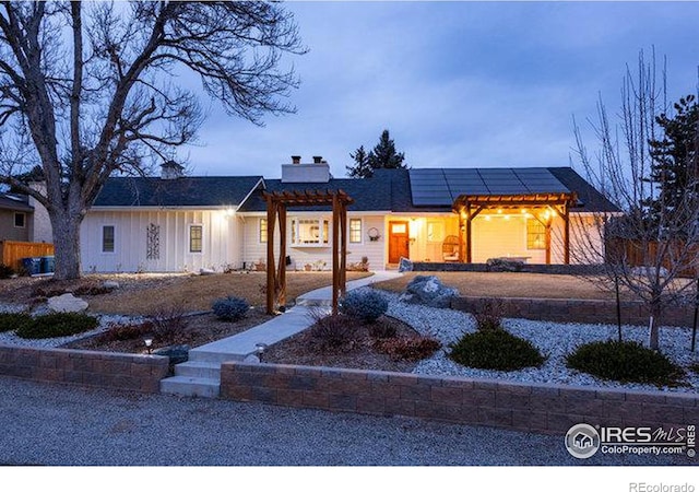 view of front of house with solar panels