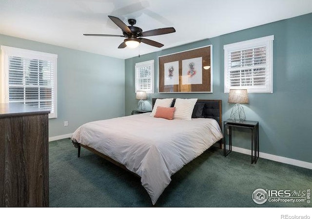 bedroom with ceiling fan and dark colored carpet