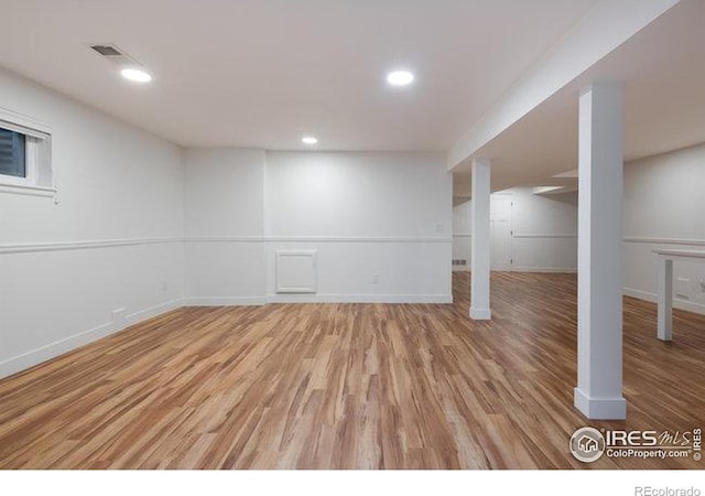 basement with wood-type flooring