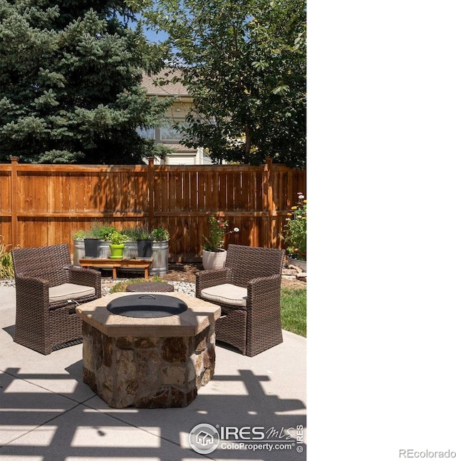 view of patio / terrace with a fire pit