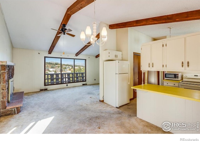 kitchen with lofted ceiling with beams, light carpet, hanging light fixtures, white appliances, and white cabinets