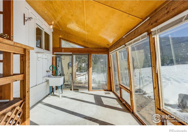 sunroom / solarium with vaulted ceiling