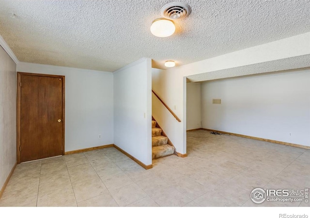 basement with a textured ceiling