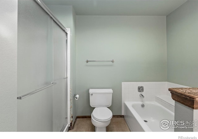 bathroom with toilet and a bathing tub