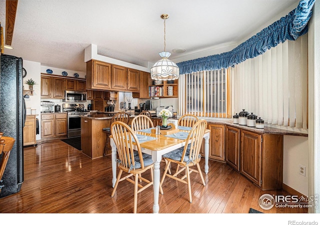 dining room with dark hardwood / wood-style floors