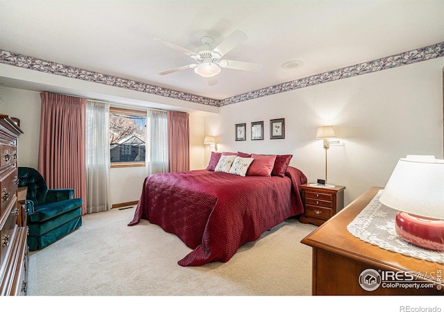 carpeted bedroom featuring ceiling fan