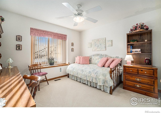 bedroom featuring light carpet and ceiling fan