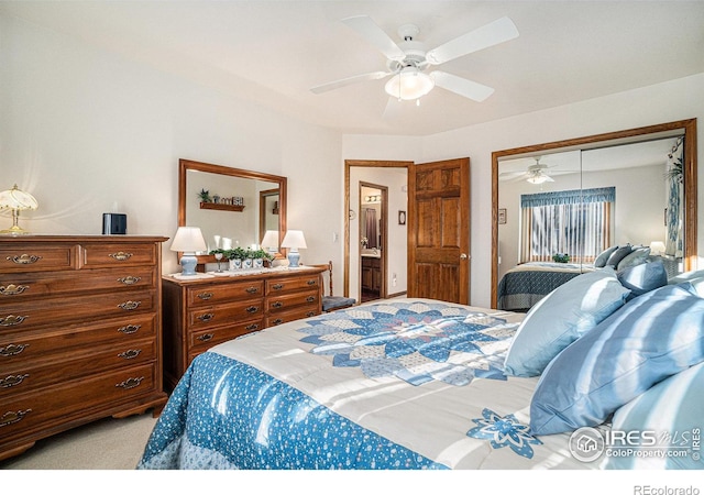 bedroom with light carpet, ceiling fan, and a closet