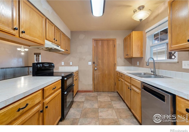 kitchen featuring dishwasher, sink, and range with two ovens