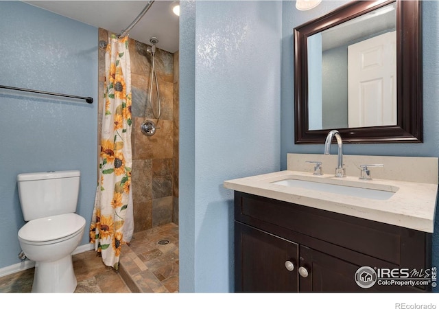 bathroom with vanity, toilet, and a shower with shower curtain