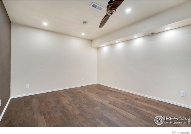 empty room featuring dark hardwood / wood-style floors and ceiling fan