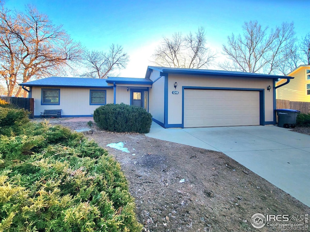 ranch-style home with a garage