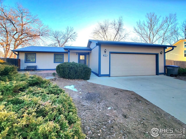 ranch-style home with a garage