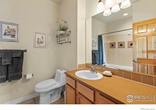 bathroom featuring tile patterned floors, toilet, and vanity