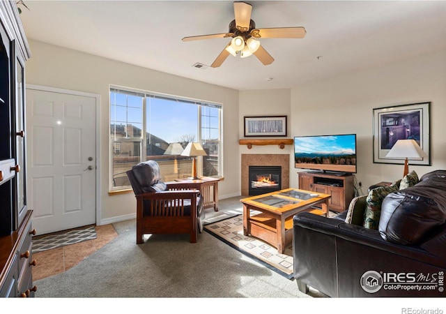 carpeted living room featuring ceiling fan