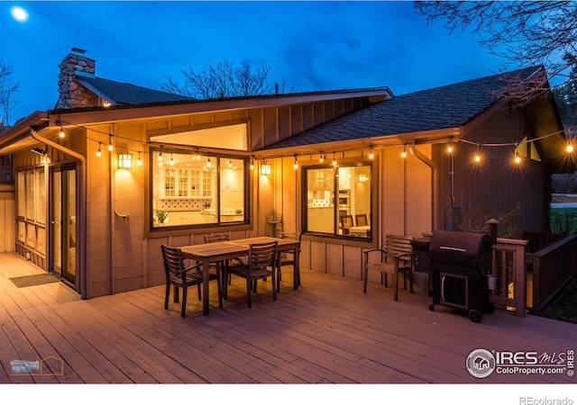 deck featuring outdoor dining area