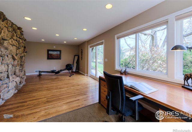 home office with baseboards, wood finished floors, and recessed lighting