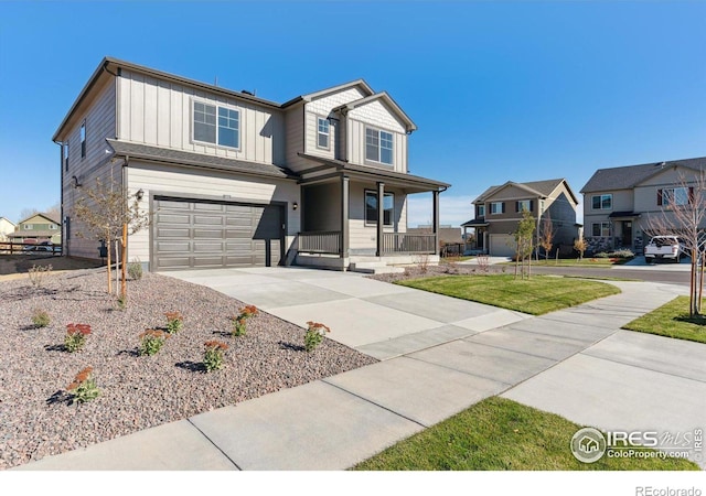 view of front of house with a garage and a porch