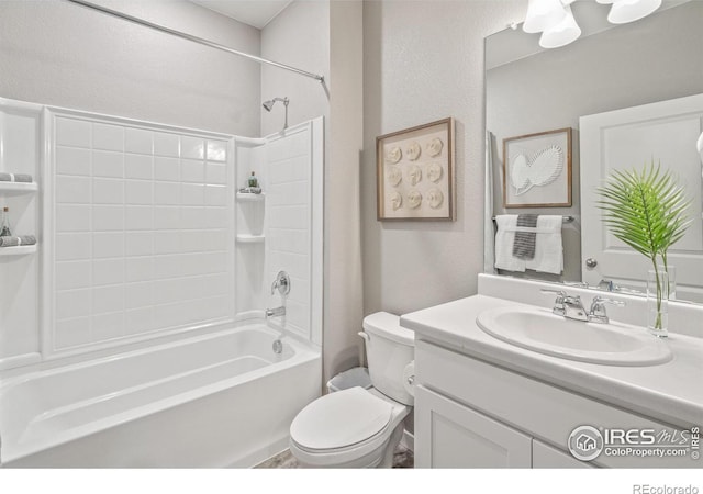 full bathroom featuring bathing tub / shower combination, vanity, and toilet